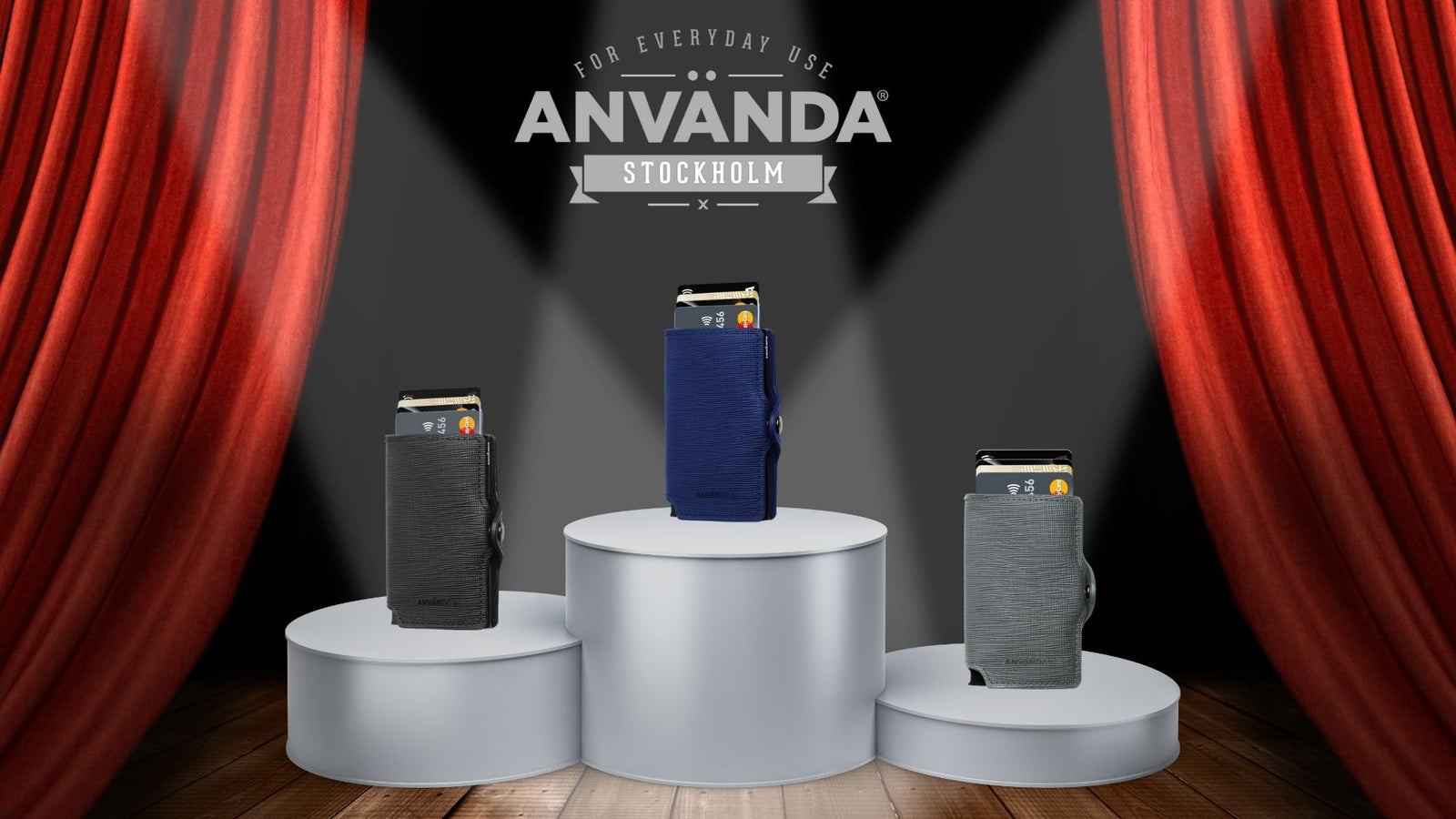 A gray Anvanda wallet leaned on a laptop