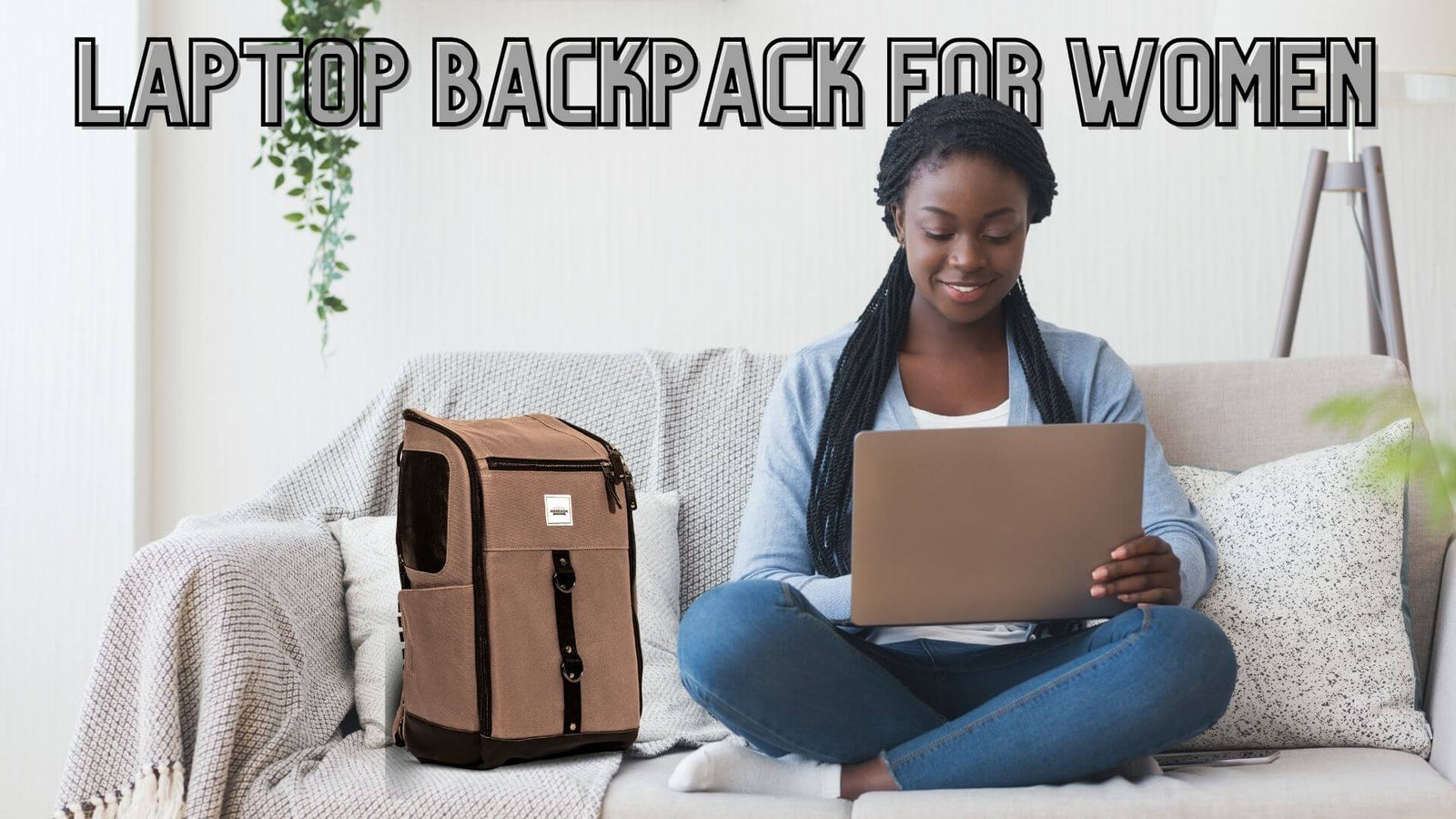 A woman working on a laptop with an Anvanda bag next to her